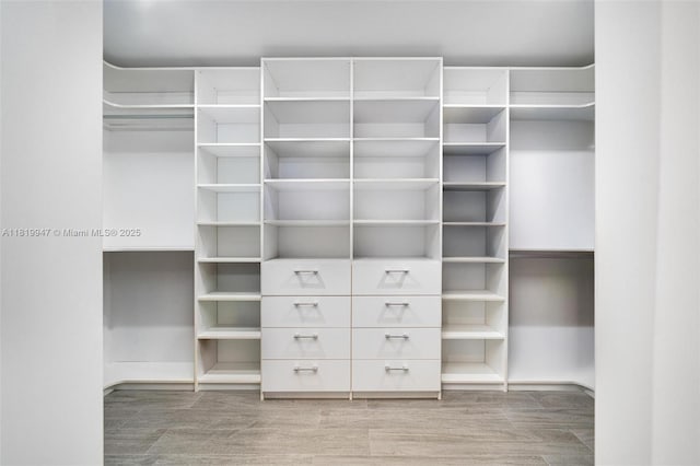 7755 Noremac Ave, Miami Beach, FL 33141 - walk in closet with wood finished floors