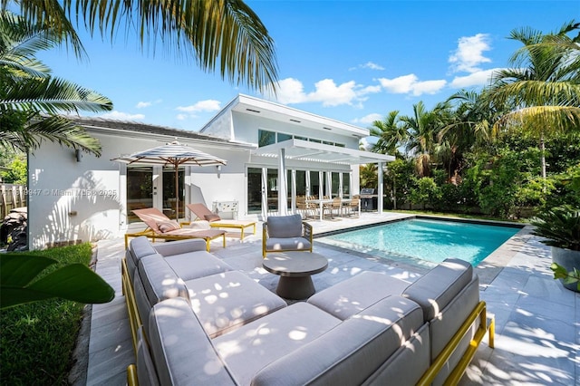 7755 Noremac Ave, Miami Beach, FL 33141 - swimming pool with outdoor lounge area, a pergola, a patio, area for grilling, and french doors