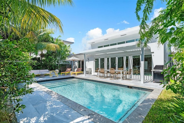 7755 Noremac Ave, Miami Beach, FL 33141 - view of swimming pool with a pergola, an outdoor living space, a patio, and grilling area