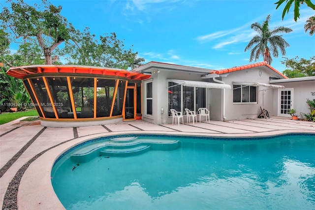 6285 Pine Ter, Plantation, FL 33317 - outdoor pool with a sunroom and a patio area