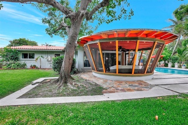 6285 Pine Ter, Plantation, FL 33317 - rear view of property featuring ceiling fan, a yard, a patio, and stucco siding
