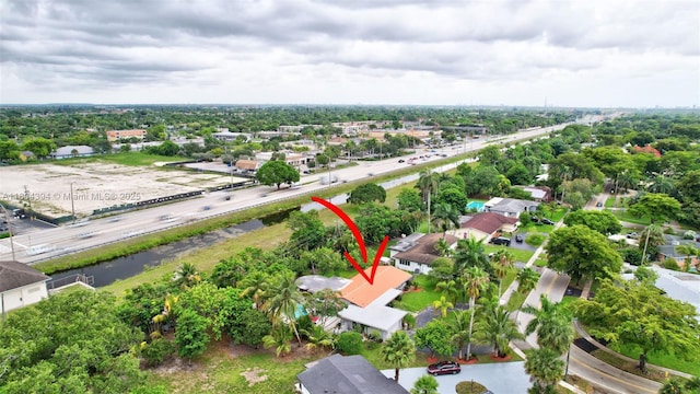 6285 Pine Ter, Plantation, FL 33317 - aerial view of property and surrounding area featuring nearby suburban area and a tree filled landscape