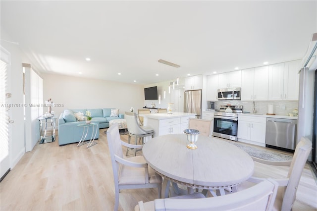 126 Piedmont C 126, Delray Beach, FL 33484 - dining space featuring light wood-style flooring and recessed lighting