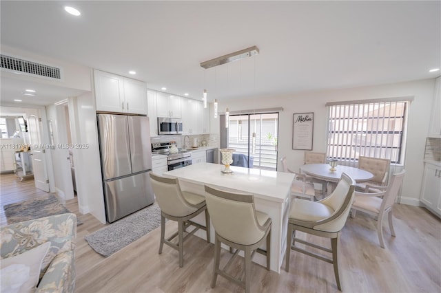 126 Piedmont C 126, Delray Beach, FL 33484 - dining area featuring light wood-type flooring and recessed lighting