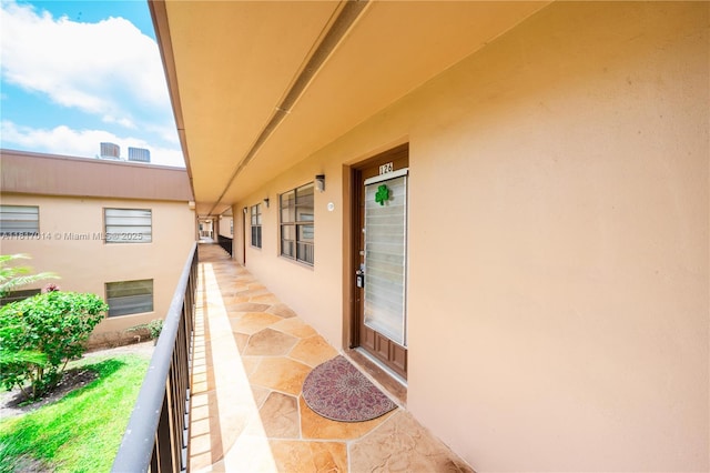 126 Piedmont C 126, Delray Beach, FL 33484 - entrance to property featuring stucco siding and a balcony