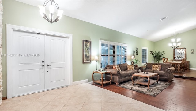 10123 Vestal Ct, Coral Springs, FL 33071 - living area with a chandelier, lofted ceiling, and wood finished floors