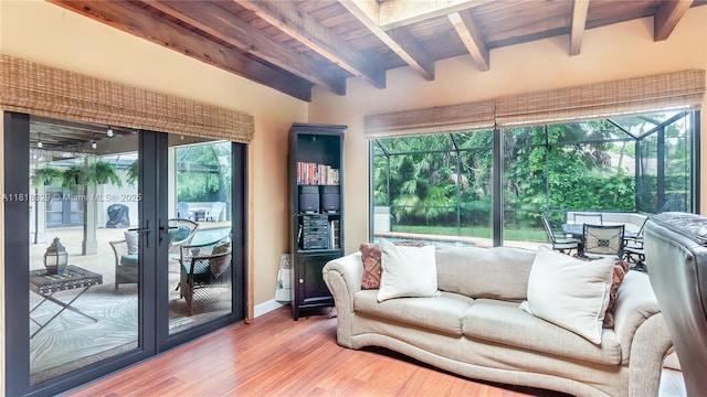 10123 Vestal Ct, Coral Springs, FL 33071 - living area featuring french doors, healthy amount of natural light, wood finished floors, and a wood ceiling with exposed beams