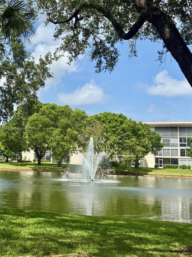 2304 Lucaya Ln Unit J1, Coconut Creek, FL 33066 - view of home's community with a water view and a lawn