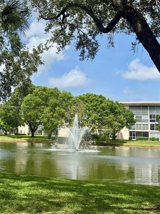 2304 Lucaya Ln Unit J1, Coconut Creek, FL 33066 - view of community with a water view and a yard