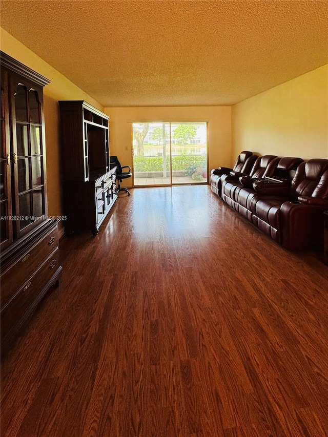2304 Lucaya Ln Unit J1, Coconut Creek, FL 33066 - living room featuring dark wood-style floors and a textured ceiling