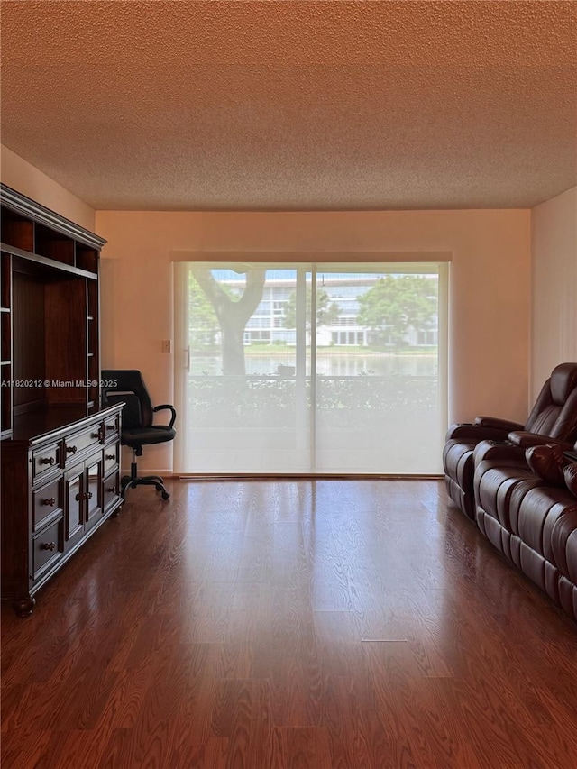 2304 Lucaya Ln Unit J1, Coconut Creek, FL 33066 - living room with a textured ceiling, wood finished floors, and plenty of natural light