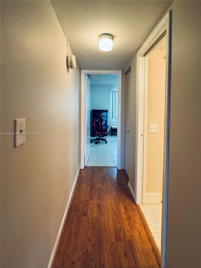 2304 Lucaya Ln Unit J1, Coconut Creek, FL 33066 - corridor featuring wood finished floors and baseboards