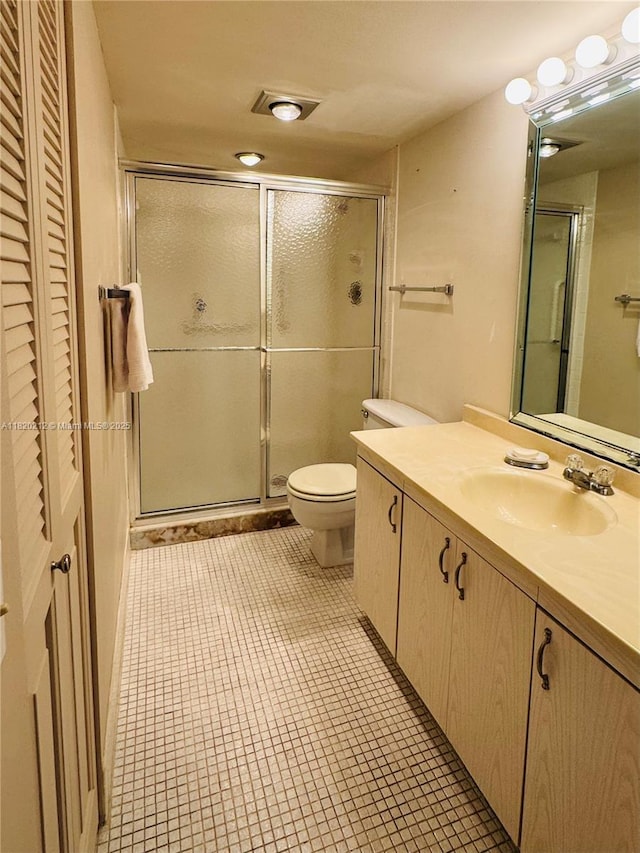2304 Lucaya Ln Unit J1, Coconut Creek, FL 33066 - bathroom featuring vanity, a stall shower, and tile patterned flooring