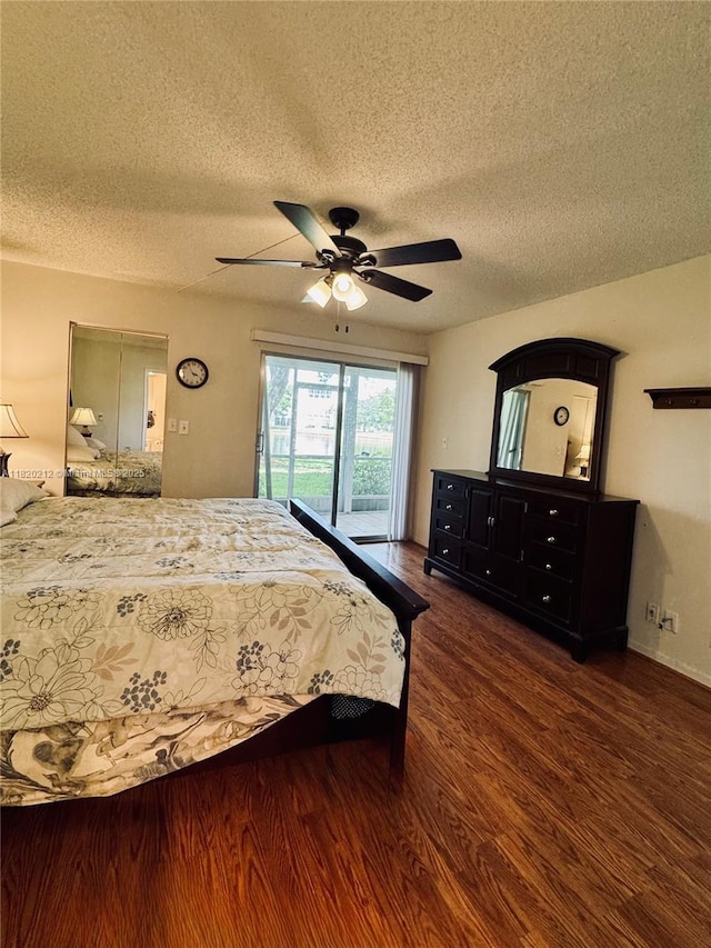 2304 Lucaya Ln Unit J1, Coconut Creek, FL 33066 - bedroom with access to exterior, wood finished floors, a textured ceiling, and a ceiling fan