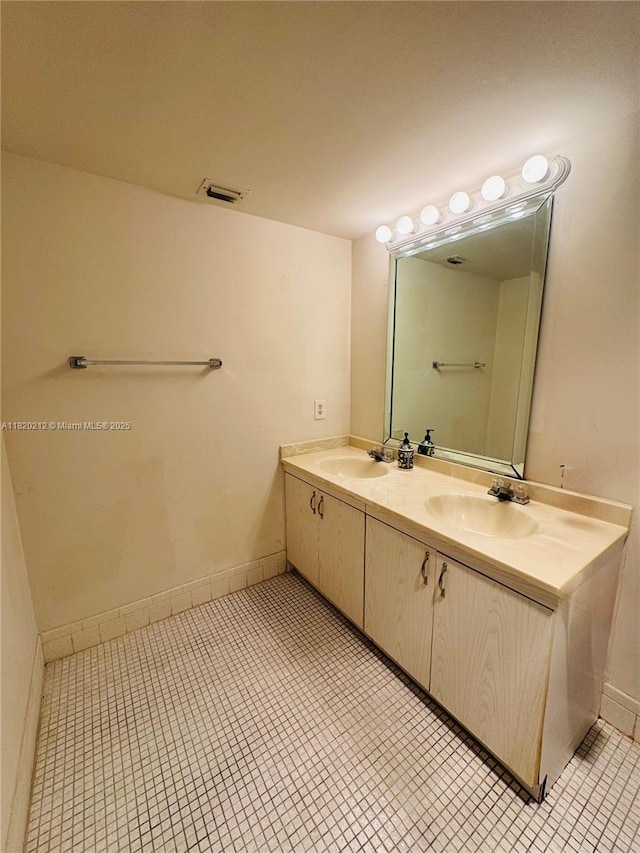 2304 Lucaya Ln Unit J1, Coconut Creek, FL 33066 - full bathroom with double vanity and tile patterned flooring