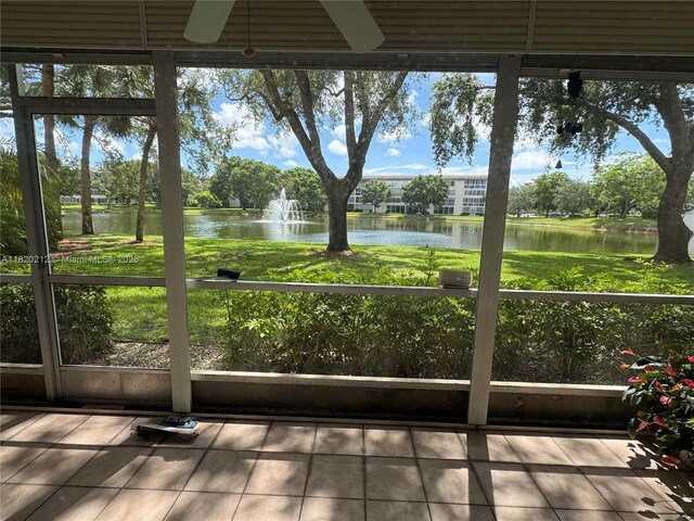 2304 Lucaya Ln Unit J1, Coconut Creek, FL 33066 - unfurnished sunroom with a water view and healthy amount of natural light