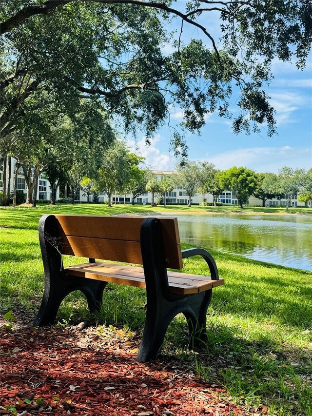 2304 Lucaya Ln Unit J1, Coconut Creek, FL 33066 - surrounding community with a water view and a yard