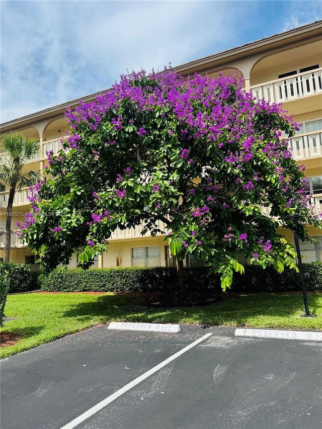 2304 Lucaya Ln Unit J1, Coconut Creek, FL 33066 - view of building exterior featuring uncovered parking