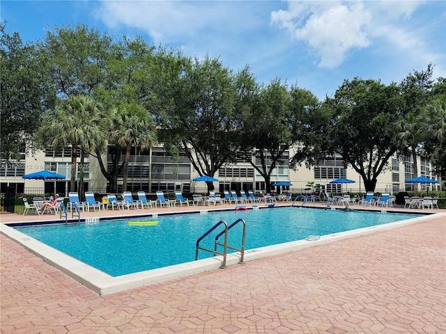 2304 Lucaya Ln Unit J1, Coconut Creek, FL 33066 - community pool featuring a patio area