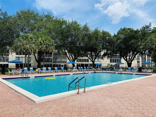 2304 Lucaya Ln Unit J1, Coconut Creek, FL 33066 - community pool with a patio area