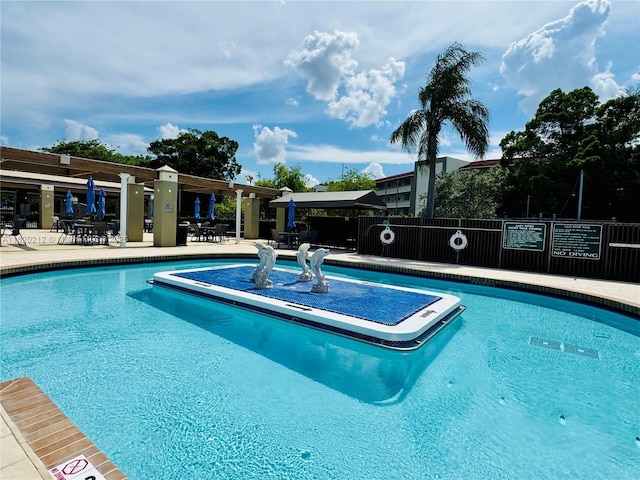 2304 Lucaya Ln Unit J1, Coconut Creek, FL 33066 - community pool with a patio area