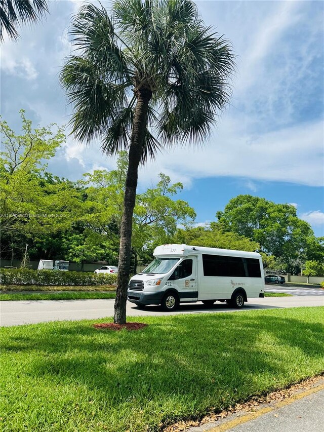 2304 Lucaya Ln Unit J1, Coconut Creek, FL 33066 - view of side of home featuring a lawn