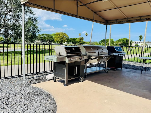 2304 Lucaya Ln Unit J1, Coconut Creek, FL 33066 - view of patio / terrace with area for grilling and a carport
