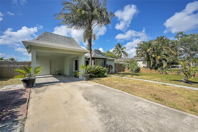 5340 SW 11th St, Margate, FL 33068 - view of front of house featuring driveway, stucco siding, an attached carport, and a shingled roof
