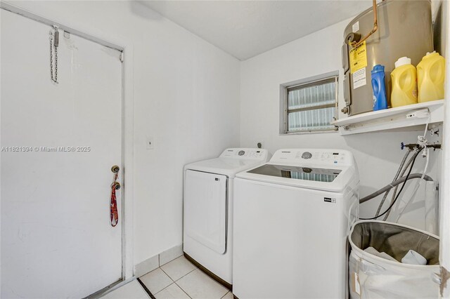 5340 SW 11th St, Margate, FL 33068 - laundry room with washing machine and dryer, light tile patterned floors, and electric water heater