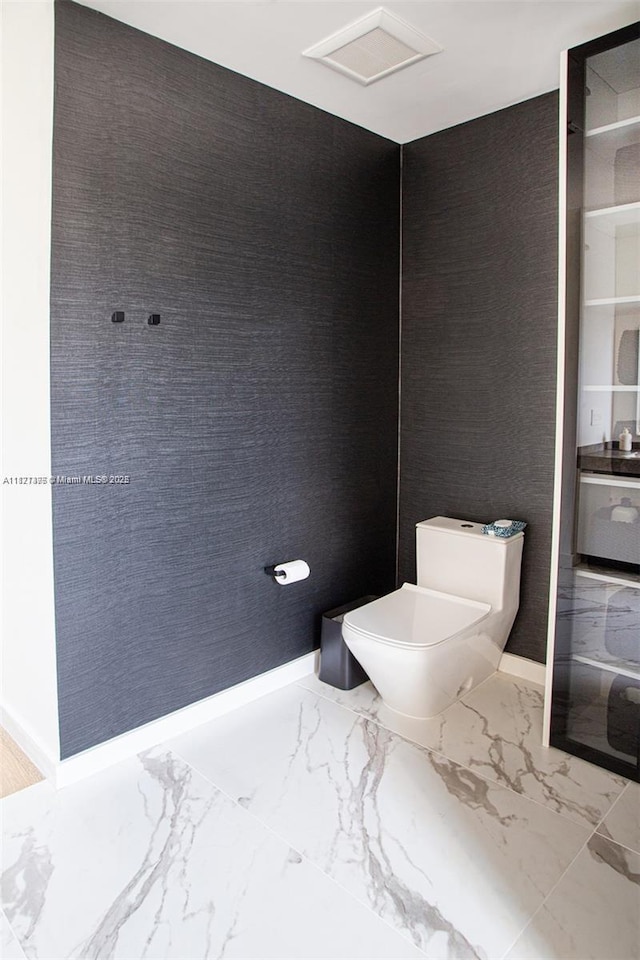 10857 NW 84th St, Doral, FL 33178 - bathroom with toilet and marble finish flooring
