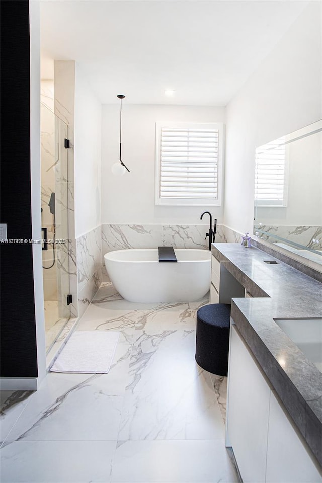 10857 NW 84th St, Doral, FL 33178 - full bath with double vanity, wainscoting, a marble finish shower, a freestanding tub, and marble tiled flooring