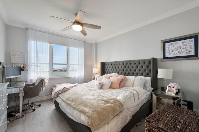 888 Brickell Key Dr Unit 1006, Miami, FL 33131 - bedroom featuring crown molding, wood finished floors, and a ceiling fan