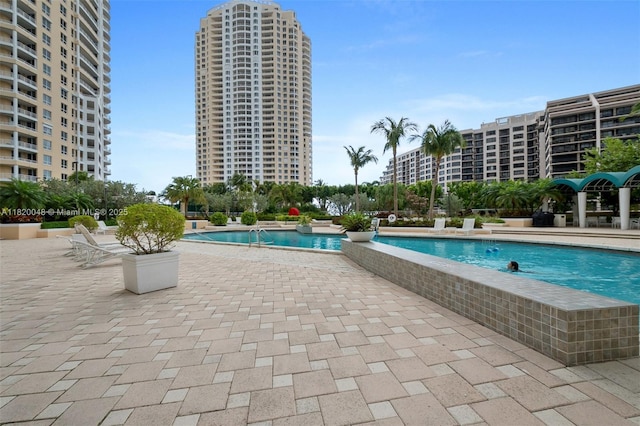 888 Brickell Key Dr Unit 1006, Miami, FL 33131 - community pool with a patio area