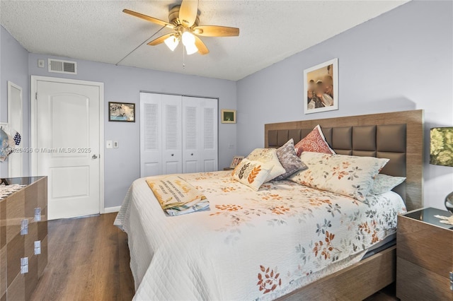 3021 Ellesmere B 3021, Deerfield Beach, FL 33442 - bedroom with dark wood finished floors, a closet, a textured ceiling, and ceiling fan