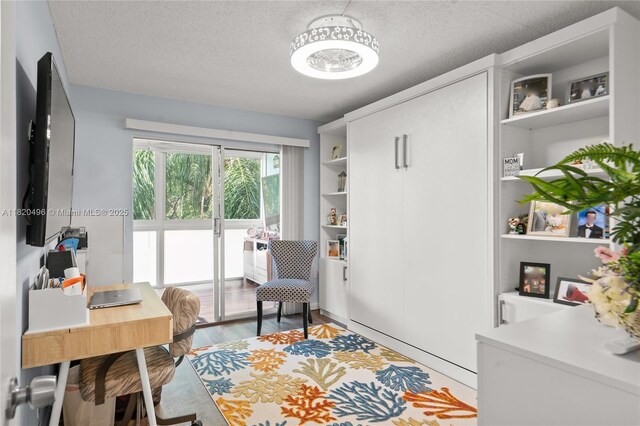 3021 Ellesmere B 3021, Deerfield Beach, FL 33442 - office featuring light wood-style flooring and a textured ceiling