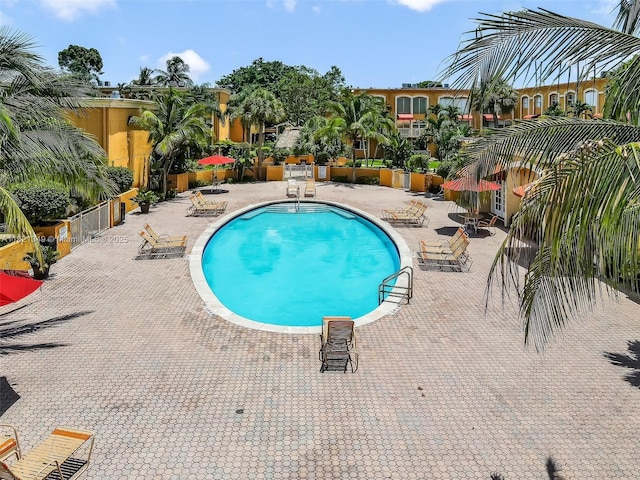 17901 NW 68th Ave Unit Q102, Hialeah, FL 33015 - community pool featuring a patio area