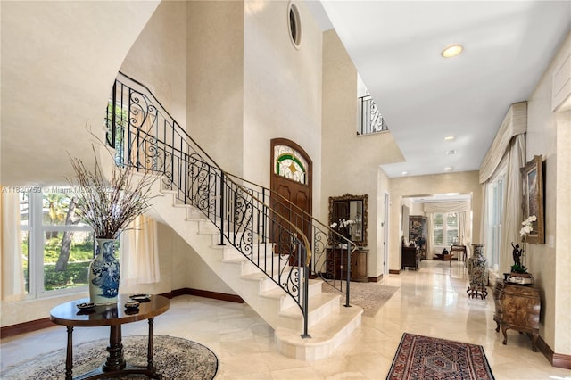 180 Solano Prado, Coral Gables, FL 33156 - foyer featuring healthy amount of natural light, a high ceiling, stairs, and recessed lighting