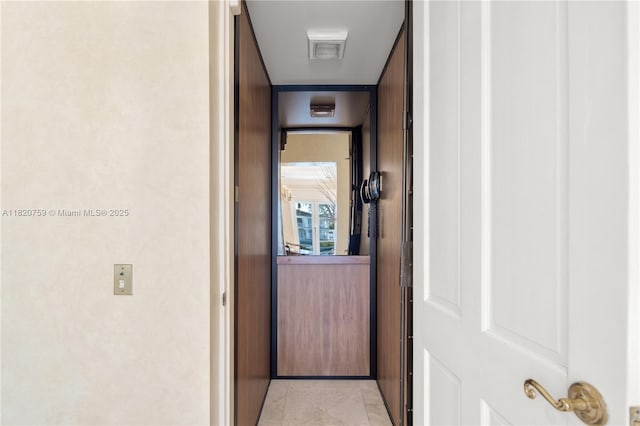 180 Solano Prado, Coral Gables, FL 33156 - hallway with elevator and light tile patterned floors