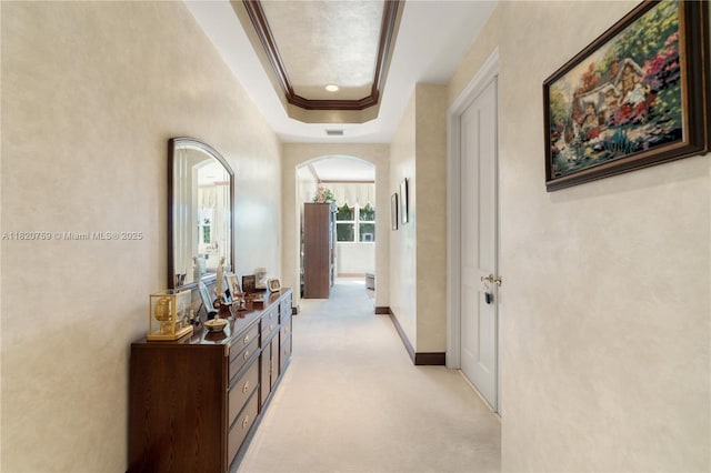 180 Solano Prado, Coral Gables, FL 33156 - corridor featuring arched walkways, light colored carpet, a tray ceiling, and crown molding