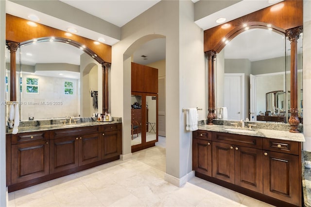 180 Solano Prado, Coral Gables, FL 33156 - full bathroom featuring decorative columns, two vanities, recessed lighting, and a shower