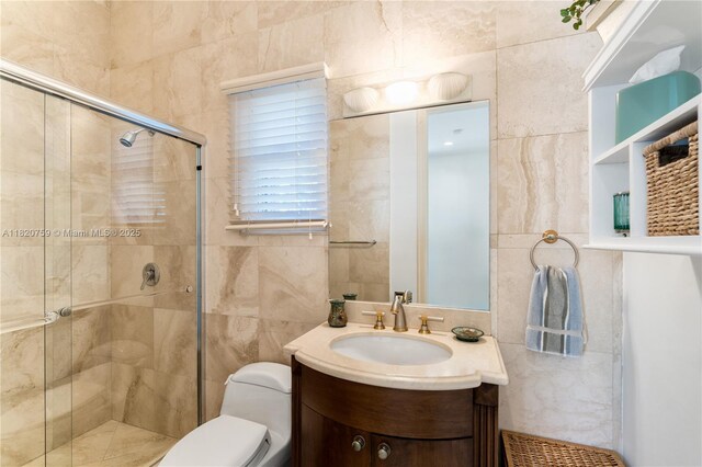 180 Solano Prado, Coral Gables, FL 33156 - bathroom featuring vanity, a shower stall, and tile walls