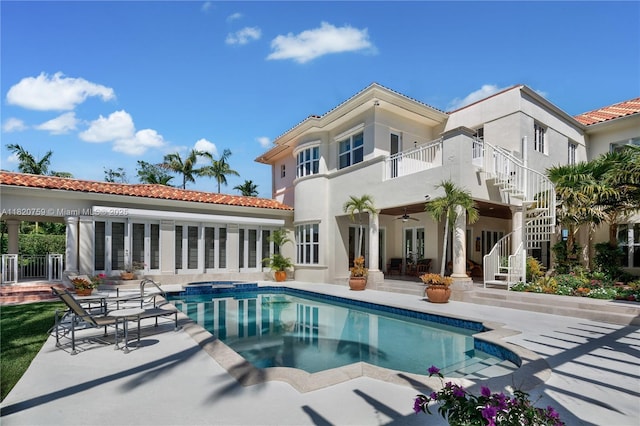 180 Solano Prado, Coral Gables, FL 33156 - rear view of property featuring a patio area, stairway, a ceiling fan, a balcony, and a pool with connected hot tub