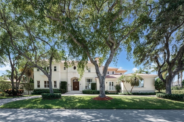 180 Solano Prado, Coral Gables, FL 33156 - mediterranean / spanish home with stucco siding, a front lawn, and a tiled roof