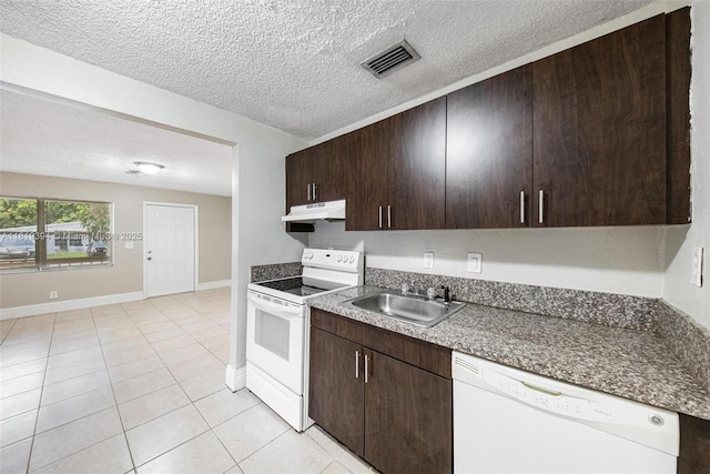 5736 Simms St, Hollywood, FL 33021 - kitchen with white appliances, under cabinet range hood, light tile patterned flooring, a textured ceiling, and dark brown cabinetry