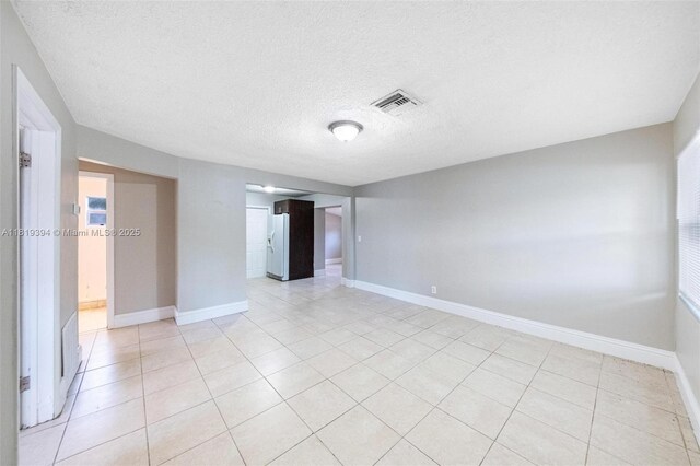5736 Simms St, Hollywood, FL 33021 - unfurnished room with light tile patterned floors and a textured ceiling