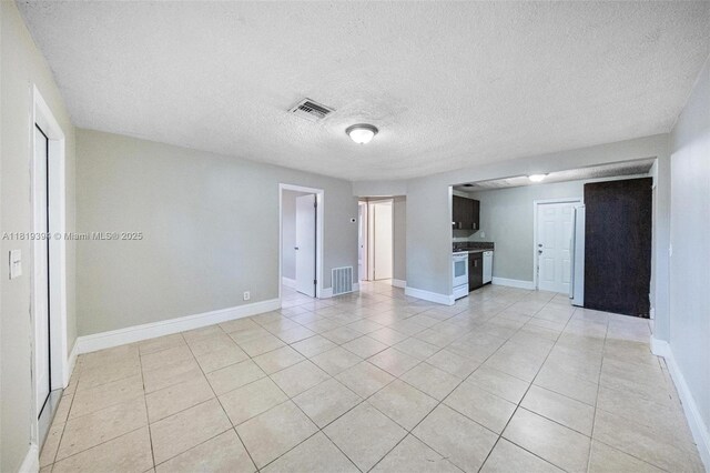 5736 Simms St, Hollywood, FL 33021 - unfurnished living room featuring light tile patterned floors and a textured ceiling