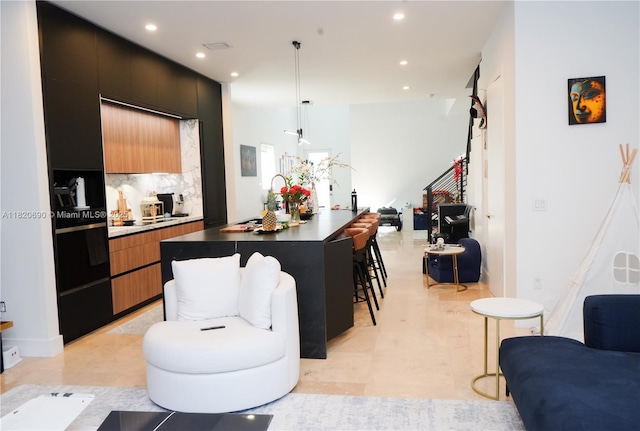 2836 W Trade Ave Unit 2836, Miami, FL 33133 - kitchen featuring open floor plan, modern cabinets, recessed lighting, a spacious island, and a breakfast bar