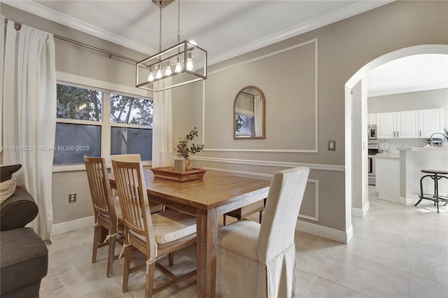 15201 SW 46th Ct, Miramar, FL 33027 - dining room featuring arched walkways, ornamental molding, a chandelier, and light tile patterned flooring