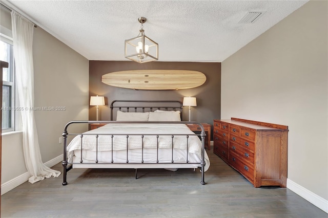 15201 SW 46th Ct, Miramar, FL 33027 - bedroom featuring wood finished floors and a textured ceiling