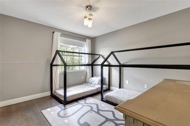 15201 SW 46th Ct, Miramar, FL 33027 - bedroom featuring wood finished floors and a textured ceiling